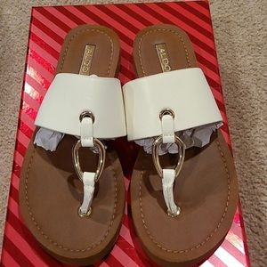 White tan flip flops / sandals with gold detail